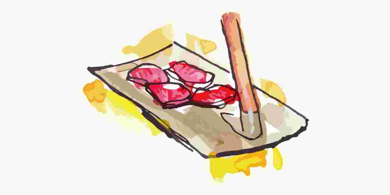 鋤で肉を焼いているイラスト