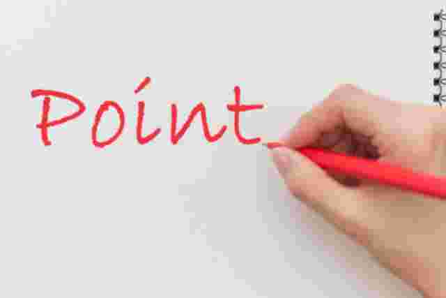 POINTの文字と赤ペンを持つ手