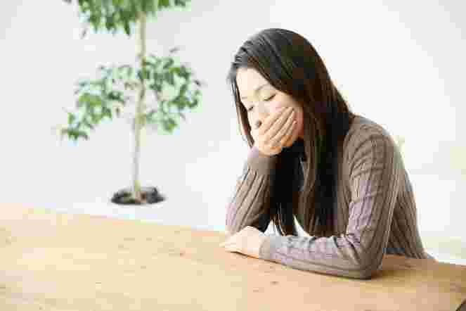 具合が悪い女性